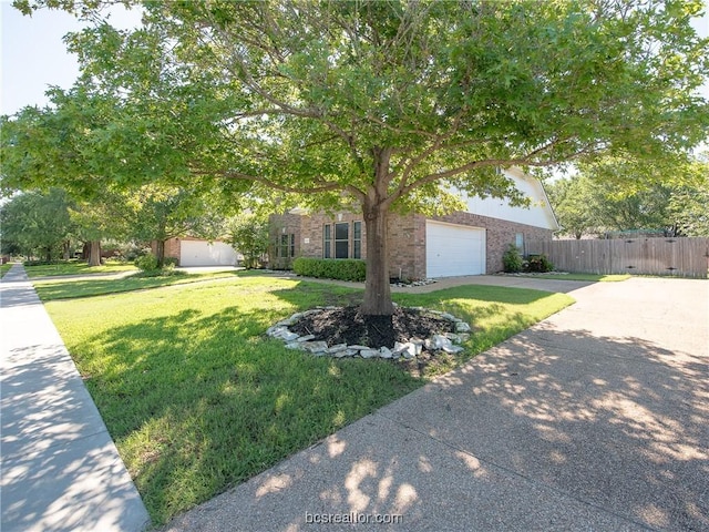 obstructed view of property with a front yard