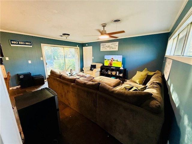 living room with hardwood / wood-style flooring, ceiling fan, and ornamental molding