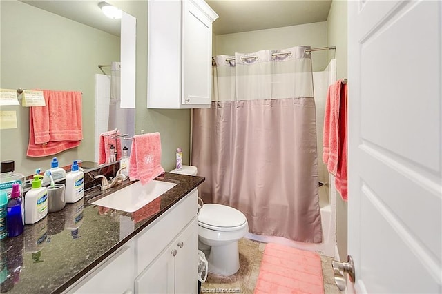 bathroom featuring toilet, shower / tub combo with curtain, and vanity