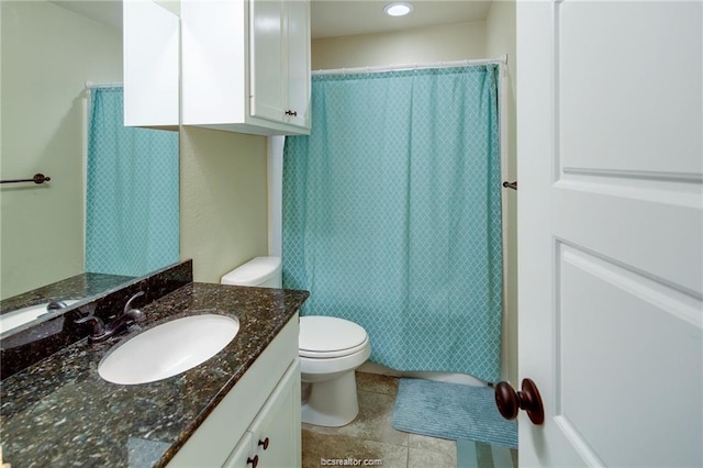 bathroom featuring toilet, tile patterned floors, shower / tub combo with curtain, and vanity