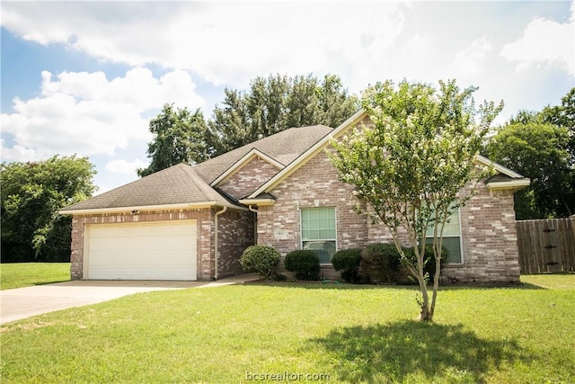 view of front of property with a front lawn and a garage