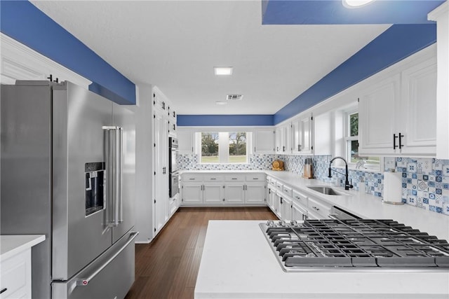 kitchen featuring light countertops, visible vents, appliances with stainless steel finishes, and a sink