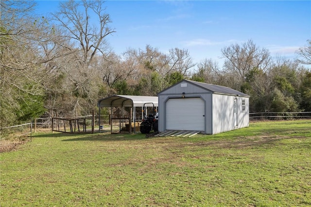 view of outbuilding with a detached carport, an outdoor structure, and fence