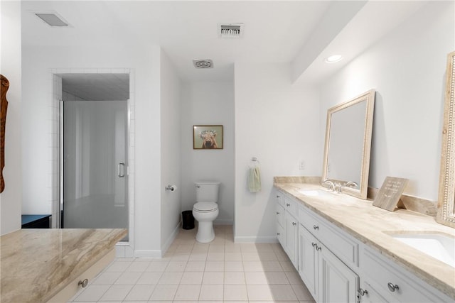 bathroom with visible vents, double vanity, a sink, a shower stall, and toilet