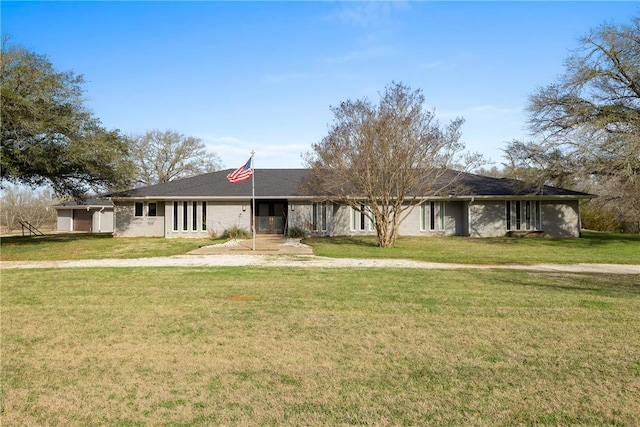 ranch-style house featuring a front lawn