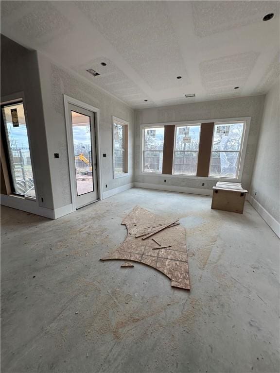 interior space featuring plenty of natural light and baseboards