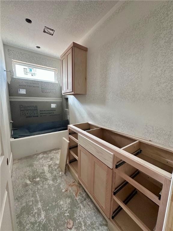 bathroom with a textured ceiling