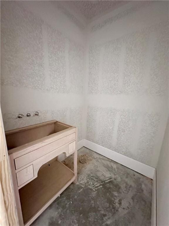 interior space with concrete flooring and vanity