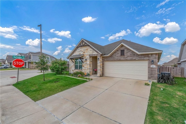 view of front of property with a front yard and a garage