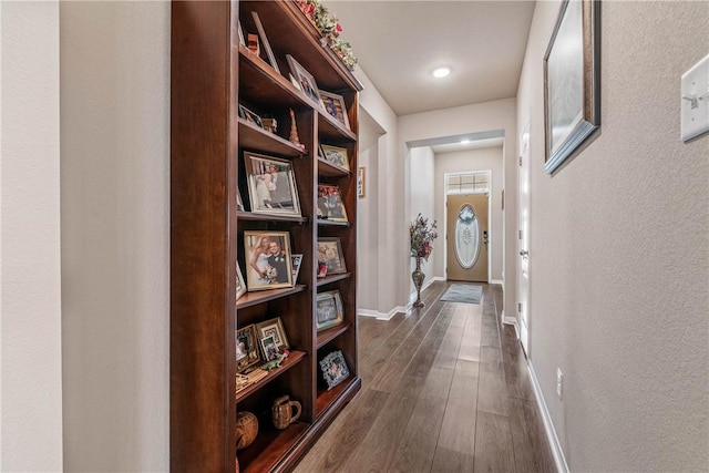 corridor with dark wood-type flooring