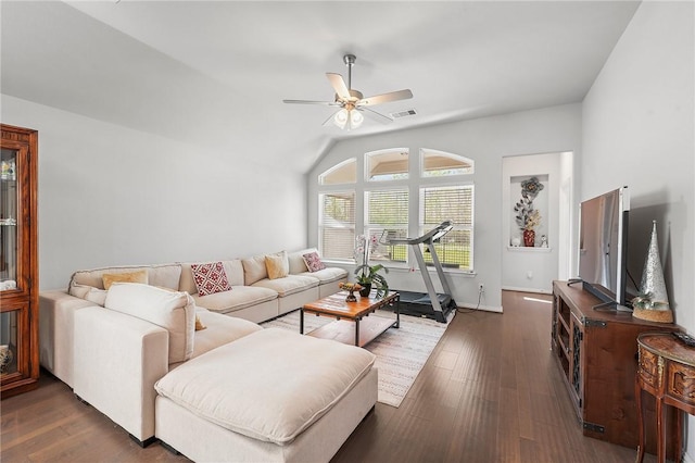 living room with dark wood-style flooring, visible vents, vaulted ceiling, and ceiling fan