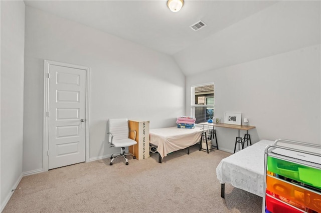 bedroom featuring carpet floors, baseboards, vaulted ceiling, and visible vents