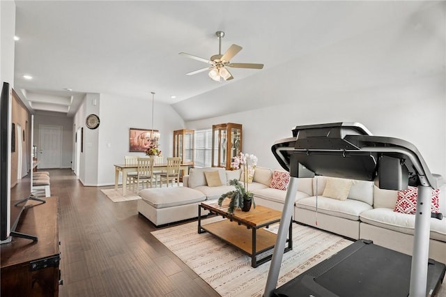 living room with ceiling fan with notable chandelier, lofted ceiling, wood finished floors, and recessed lighting