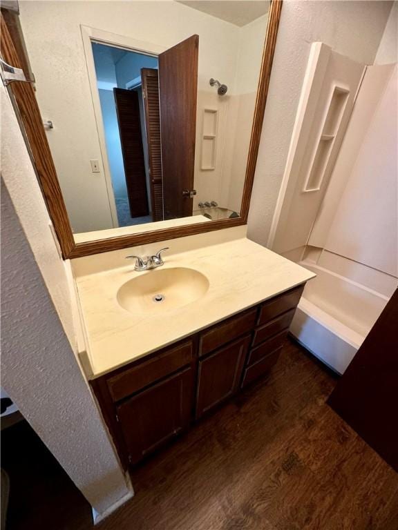 bathroom with vanity and wood-type flooring