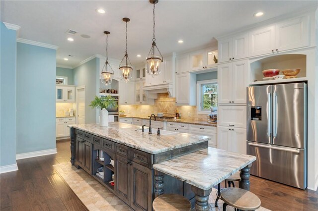 5395 Stirrup Dr, College Station, TX 77845 - kitchen featuring appliances with stainless steel finishes, open shelves, a sink, white cabinetry, and ornamental molding