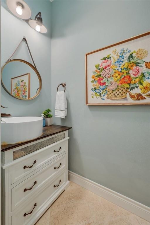 5395 Stirrup Dr, College Station, TX 77845 - bathroom featuring baseboards and vanity
