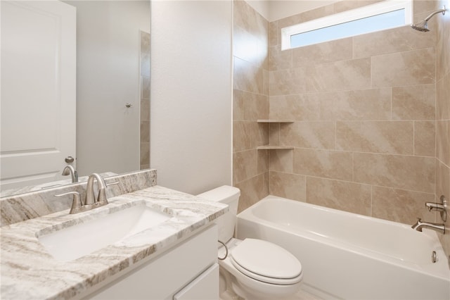 full bathroom with vanity, toilet, and tiled shower / bath