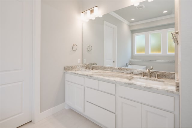 bathroom with crown molding, tile patterned flooring, and vanity