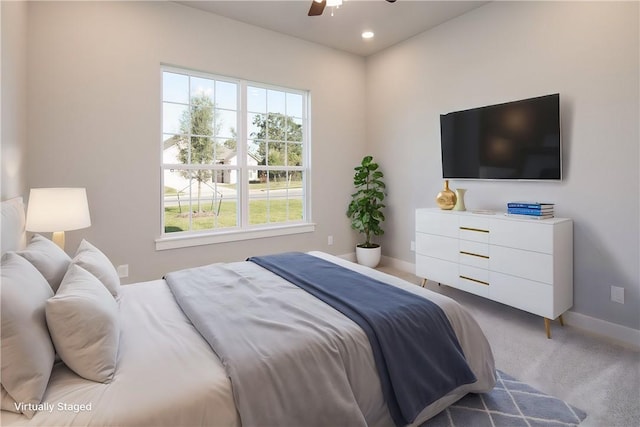 carpeted bedroom with ceiling fan