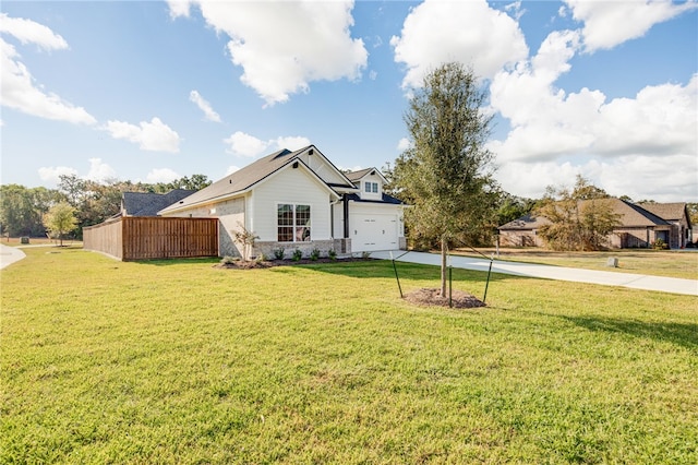 exterior space with a garage and a yard