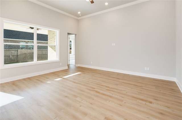 unfurnished room featuring ceiling fan, crown molding, and light wood-type flooring