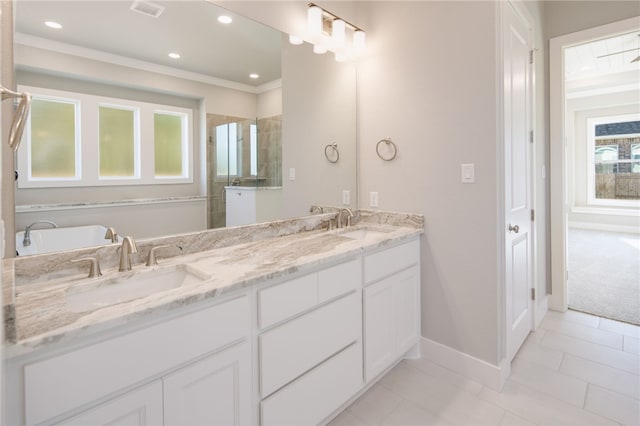 bathroom with tile patterned floors, a wealth of natural light, vanity, and a shower with shower door