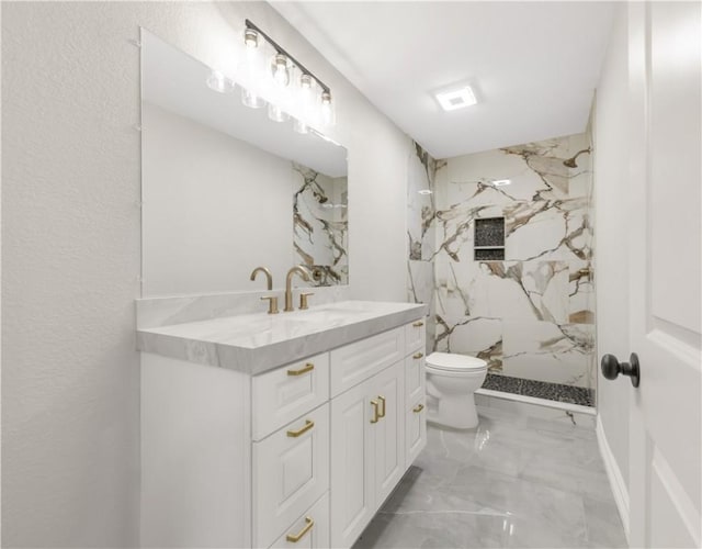 bathroom featuring vanity, toilet, tile walls, and a tile shower