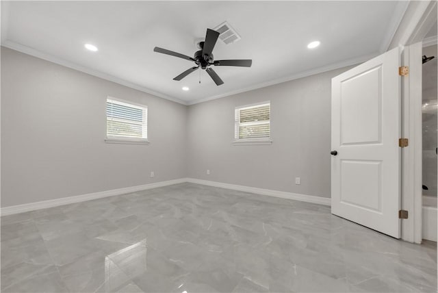 empty room featuring ceiling fan and crown molding