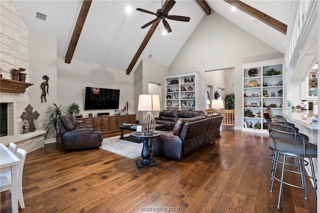 living room featuring dark hardwood / wood-style flooring, a fireplace, high vaulted ceiling, and beamed ceiling