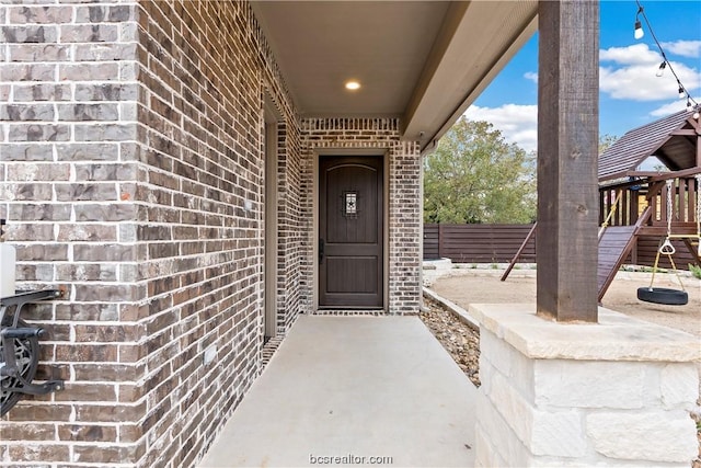 entrance to property featuring a patio