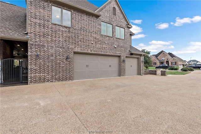 view of side of property with a garage