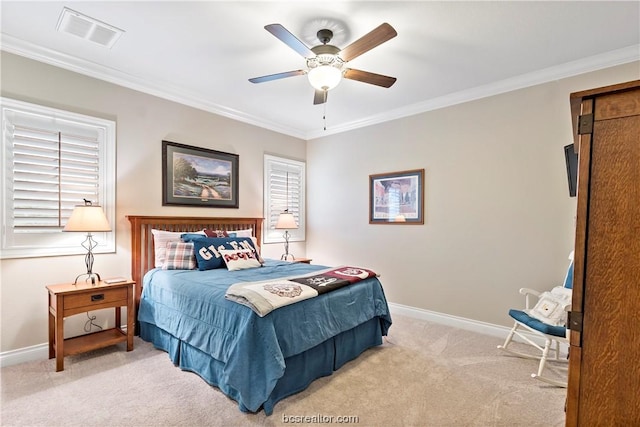 bedroom featuring ceiling fan, crown molding, and light carpet