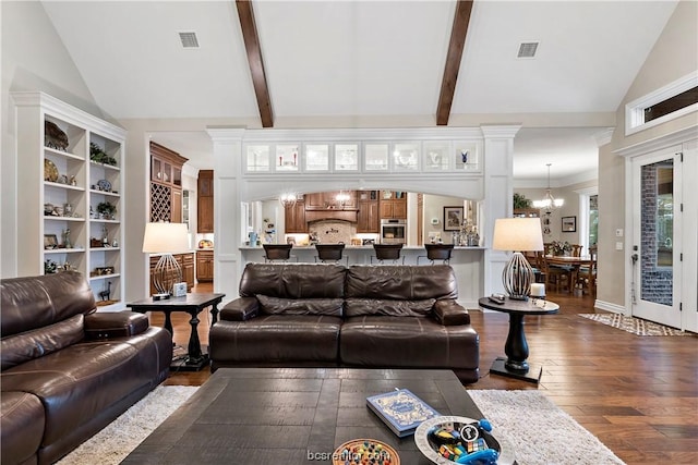 living room with beamed ceiling, dark hardwood / wood-style flooring, high vaulted ceiling, and an inviting chandelier