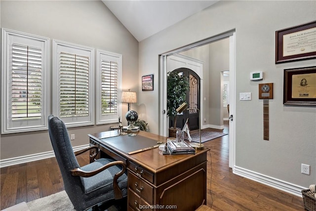 office area with dark hardwood / wood-style flooring and vaulted ceiling