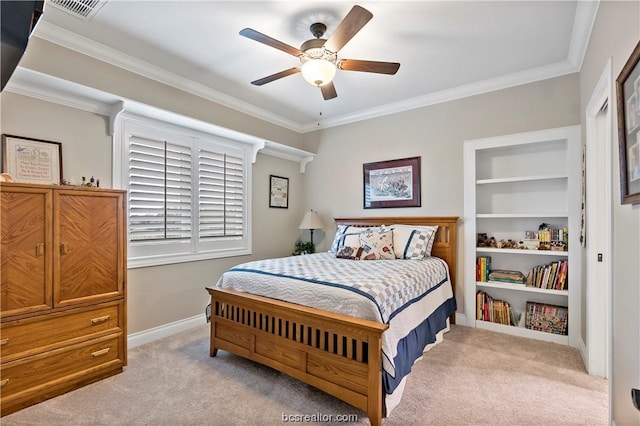 carpeted bedroom with ceiling fan and ornamental molding