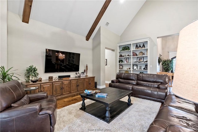 living room with beam ceiling, high vaulted ceiling, and hardwood / wood-style flooring