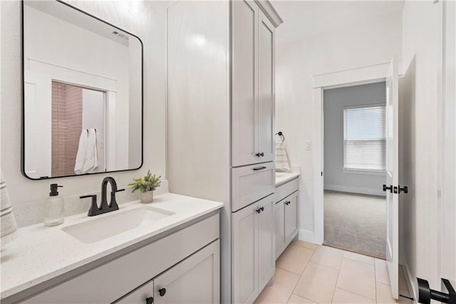 bathroom with tile patterned flooring and vanity