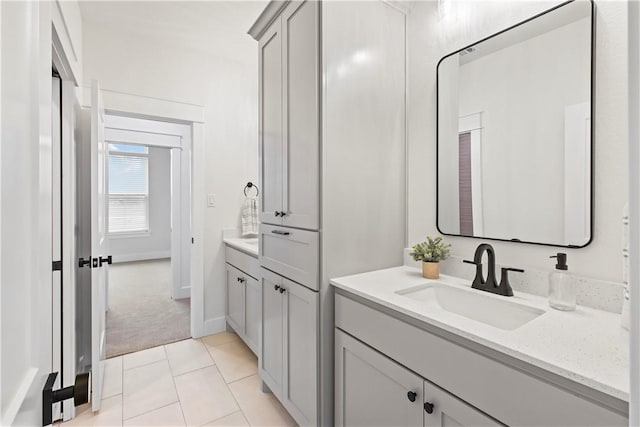 bathroom with tile patterned floors and vanity