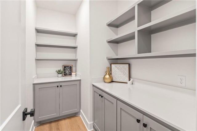 interior space featuring light hardwood / wood-style floors and gray cabinetry