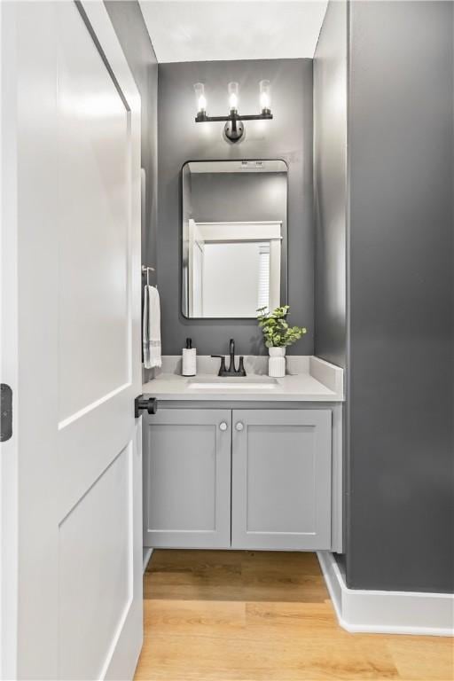 bathroom featuring hardwood / wood-style floors and vanity