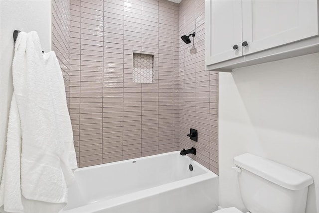 bathroom featuring shower / bath combo and toilet