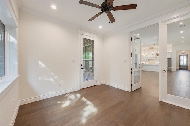 empty room with recessed lighting, a ceiling fan, crown molding, visible vents, and wood finished floors