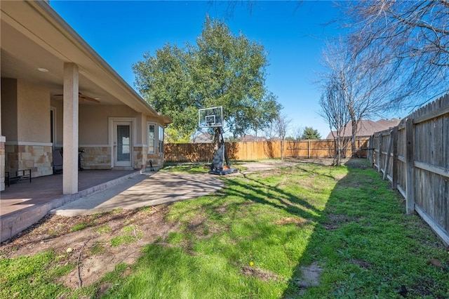 view of yard featuring a patio and ceiling fan