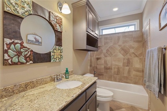 full bathroom featuring ornamental molding, vanity, toilet, and tiled shower / bath combo