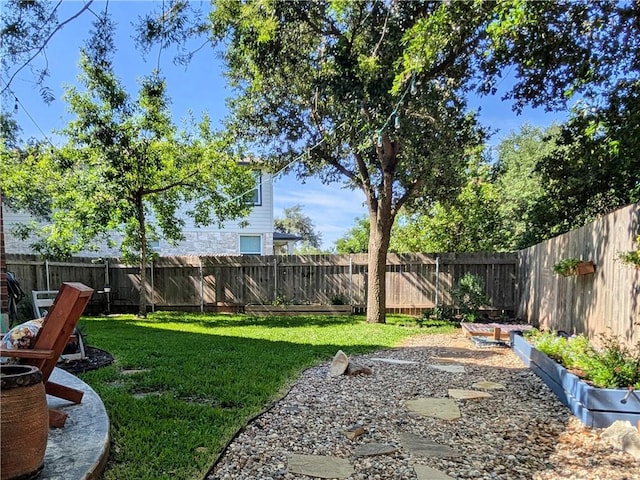 14504 Templemore Cv, Austin, TX 78717 - view of yard featuring a fenced backyard and a vegetable garden
