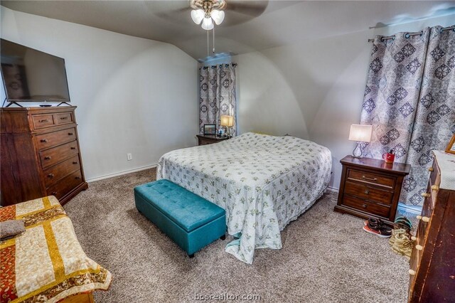 carpeted bedroom with ceiling fan and lofted ceiling