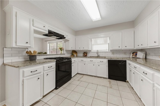 2904 Adrienne Dr, College Station, TX 77845 - kitchen featuring black appliances, exhaust hood, decorative backsplash, a textured ceiling, and white cabinets