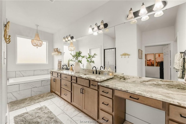 bathroom featuring shower with separate bathtub and vanity