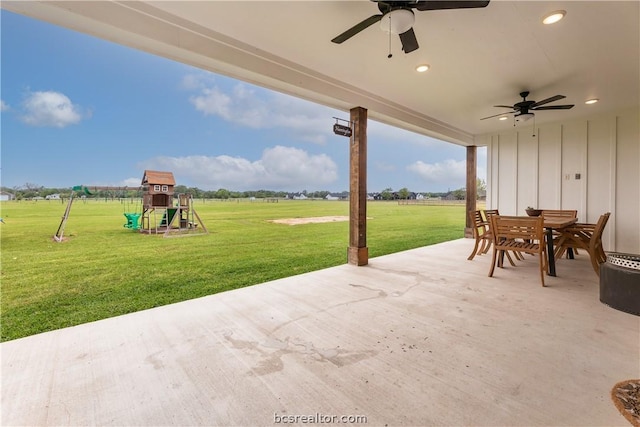 view of patio featuring ceiling fan and a playground