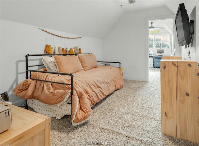 carpeted bedroom featuring lofted ceiling